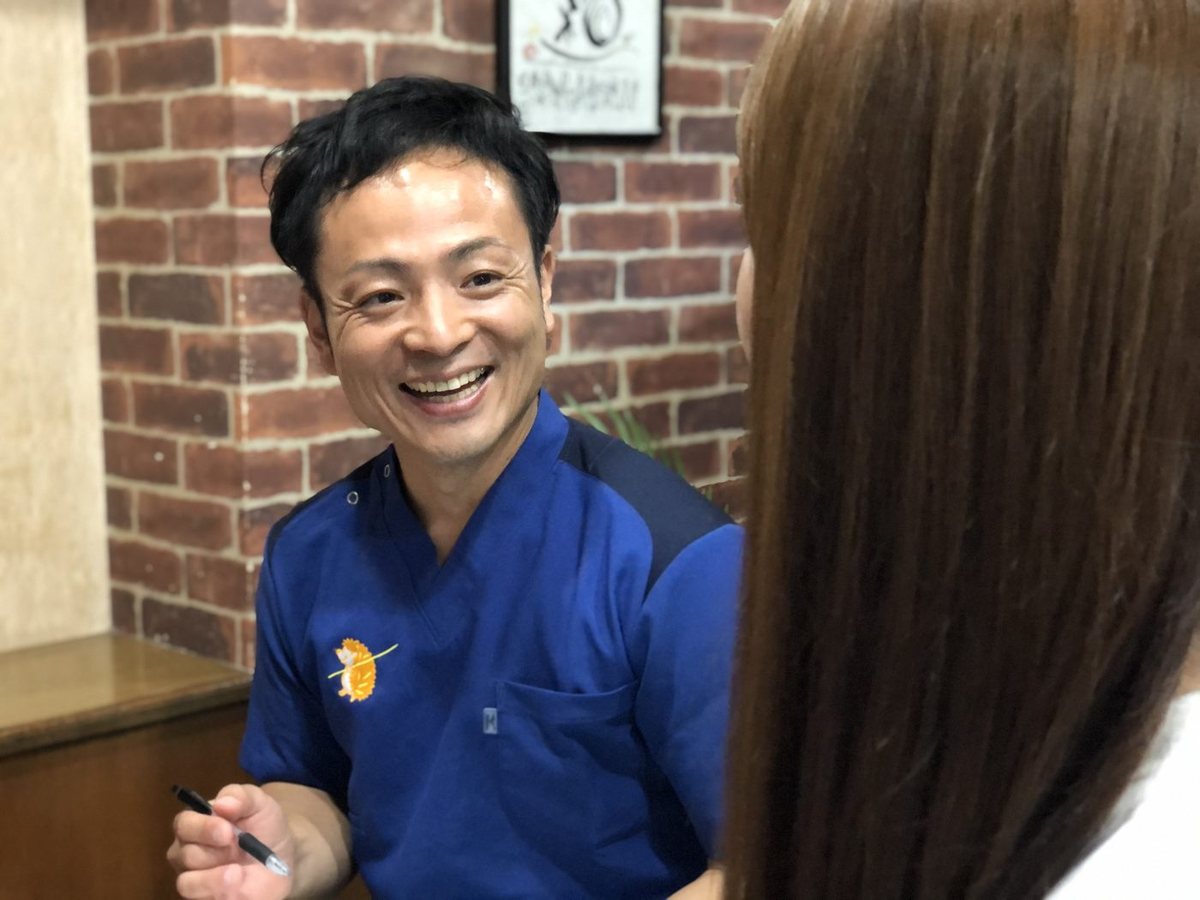 矢上真吾 院長 ── 問診の様子